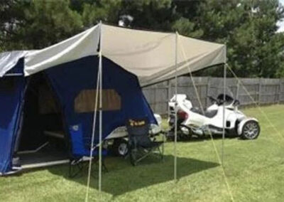Dark blue Excel II (2022 Model) with awning